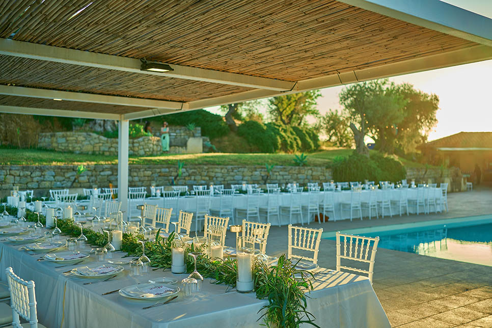 Table settings by the pool with sea view