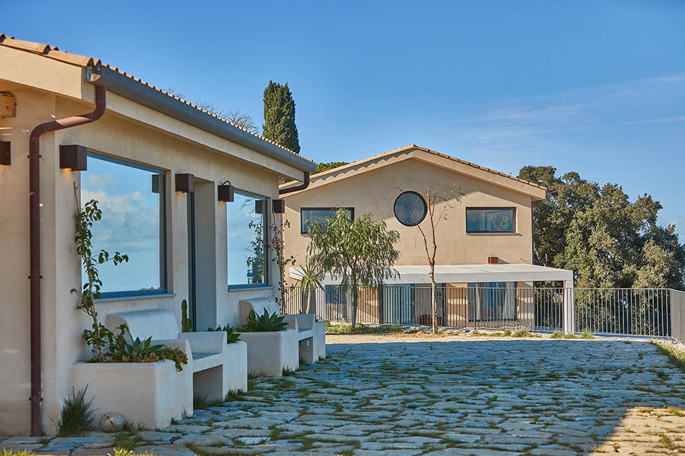 The guest house and the main house on the background