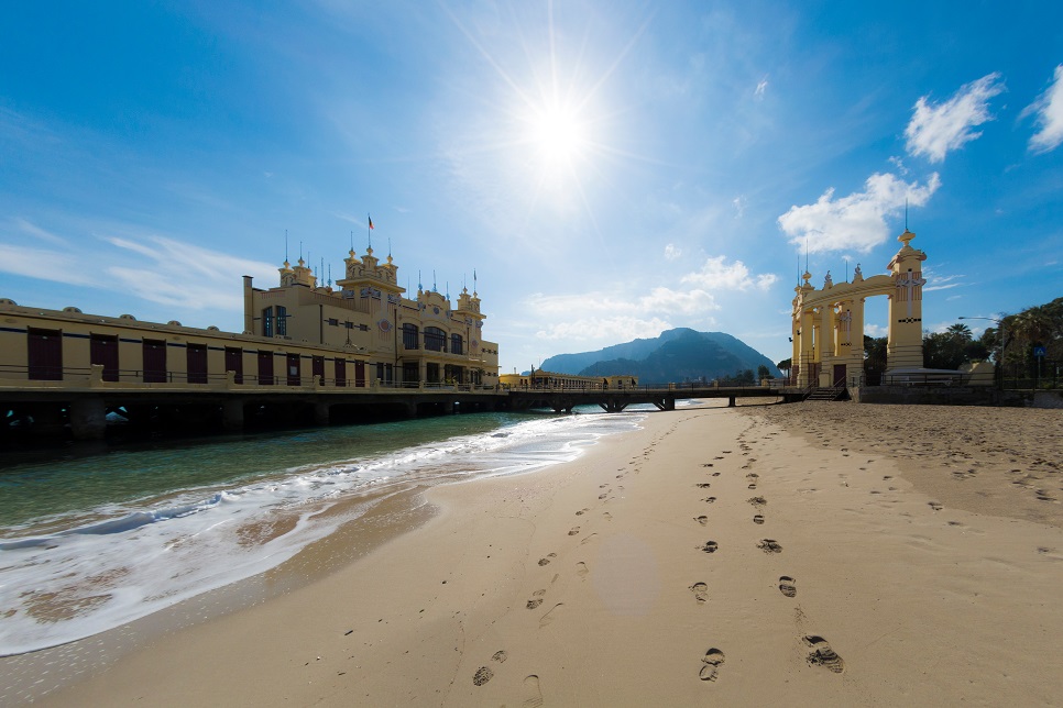 The beach and a pier building at Mondello