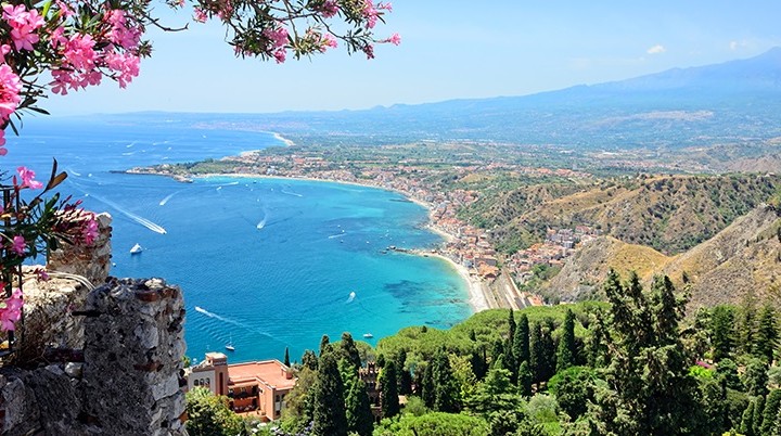 Taormina town with Mount Etna on background